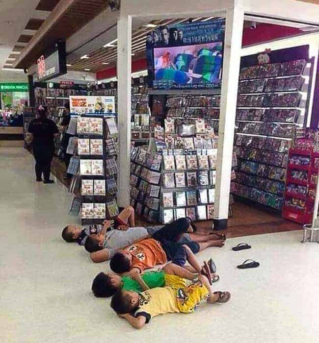 The Joys Of Shopping With Kids lying on floor tv