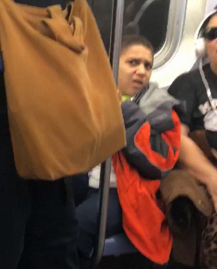 Kid Refuses to Move His Legs on a Subway, So a Guy Sits on Them Instead