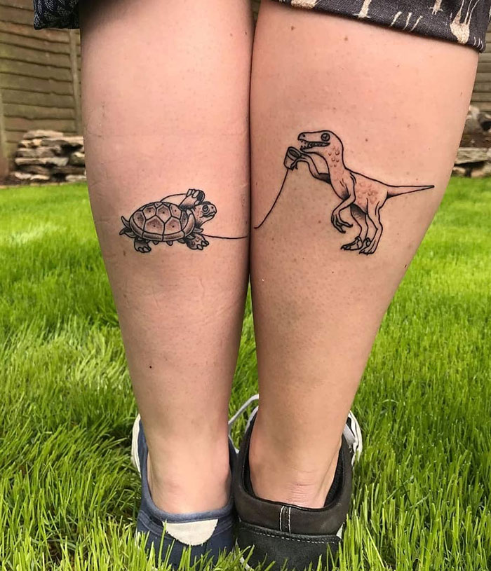 couples tattoo dinosaur matching writing tattoo small black  Reds Tattoo