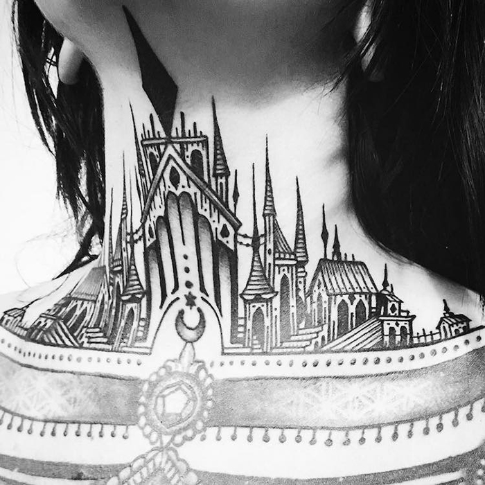 Engraving style castle tattoo located on the upper arm