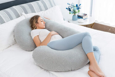 This C-Shaped Pregnancy Pillow Supports Your Bump While You Sleep